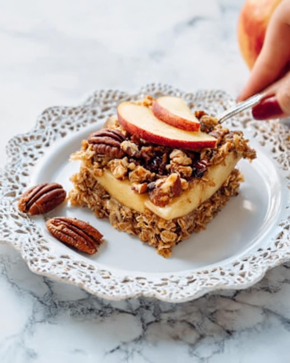 A clear square glass dish holds seven round, rough-textured oatmeal cookies with a golden brown color, showing small chunks of oats and a slightly crumbly surface. A woman's hand is reaching in from the left side, touching one cookie at the bottom left corner of the dish. The dish is placed on a white marbled surface. photo taken with an iphone --ar 4:5 --v 7