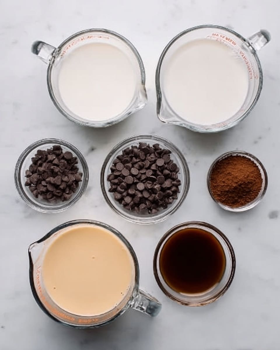 The image shows six clear glass bowls and measuring cups arranged on a white marbled surface. There are two large measuring cups filled with white liquid, one placed on the left and the other on the top right. A small glass bowl containing dark brown powder is at the top right next to the measuring cup. Another small bowl in the center holds many small dark brown chocolate chips. To the bottom left, a large measuring cup is filled with a light beige creamy liquid. At the top center, there is a very small glass bowl with dark brown liquid. The colors and textures contrast against the clean white marbled background. Photo taken with an iphone --ar 4:5 --v 7