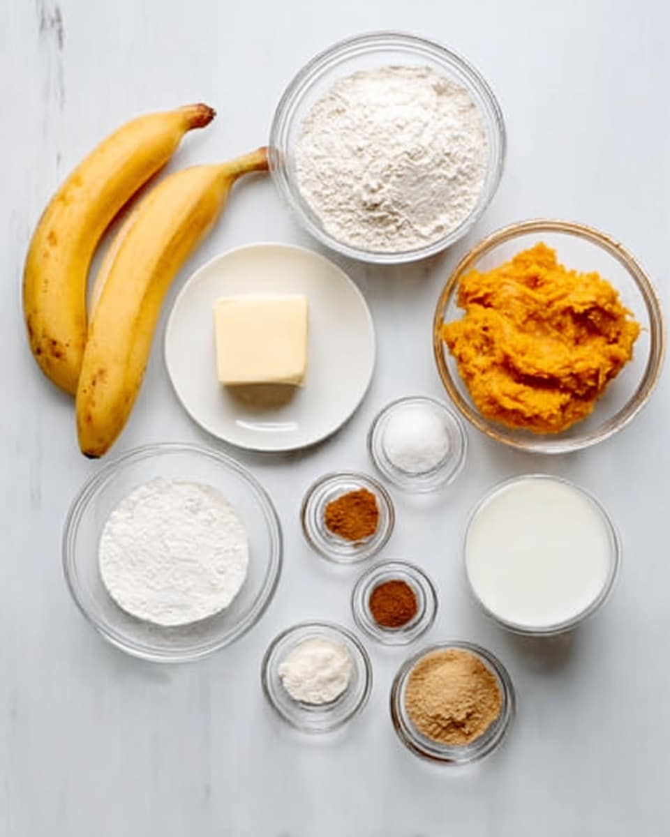 The image shows ingredients for baking placed on a white marbled surface. There are two yellow bananas on the left bottom side. Above the bananas, there is a white bowl filled with white flour. Next to it, on the right, is a small clear bowl filled with orange mashed pumpkins. To the right of the pumpkins, there is a tiny white bowl holding three spices in brown, beige, and dark brown colors. Below these, a white bowl filled with white sugar is placed near the center. Slightly left and below is a small cube of pale yellow butter on a small white plate. To the right of the butter, three small clear bowls hold light brown cinnamon powder, white liquid (vanilla extract), and a white powder (baking soda). A white bowl of milk is placed centrally near the bottom right. The overall arrangement is neat with each bowl showing a clear texture of the ingredient inside, set on the smooth white marbled surface photo taken with an iphone --ar 4:5 --v 7