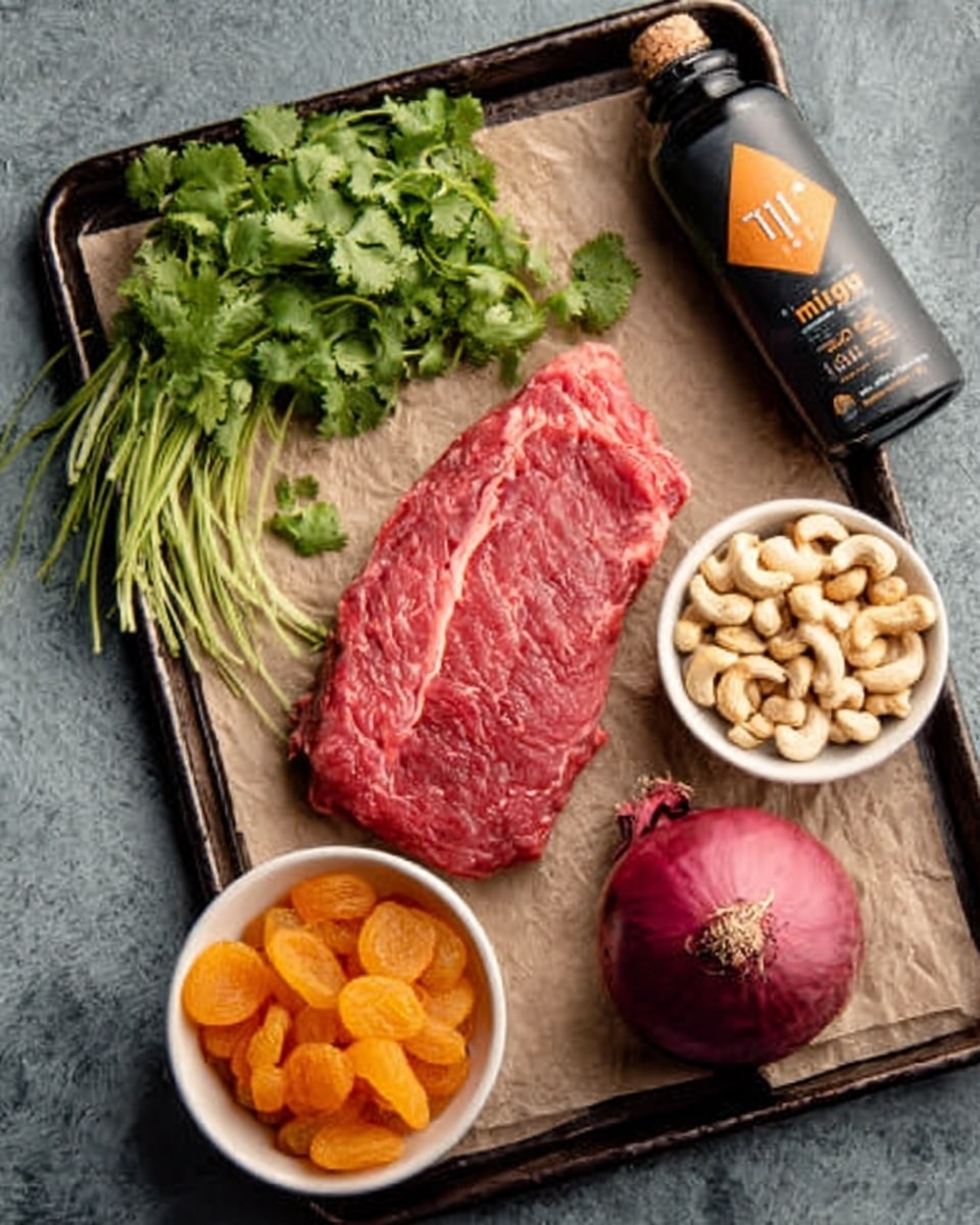 The image shows a raw red steak with visible marbling laid on brown parchment paper on a black tray. Around the steak, there is a bunch of fresh green cilantro with delicate leaves placed below it. To the right side, there is a small white bowl filled with light beige cashew nuts. Below the cashew bowl, another white bowl holds bright orange dried apricots. On the bottom right corner of the tray, there is a whole red onion with shiny skin. At the top right side of the tray, there is a black bottle labeled mini tagine with an orange triangle icon. The tray is set on a white marbled surface. photo taken with an iphone --ar 4:5 --v 7