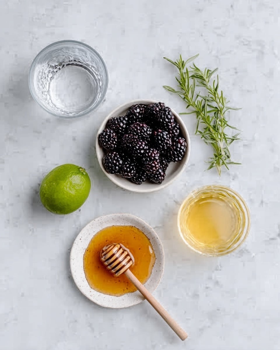 The image shows a white marbled surface with several items neatly placed on it. At the top center, there is a small white bowl filled with dark blackberries with a rough texture. To the left, there is a clear glass of water. Below the bowl of blackberries, there is a half-cut lime showing its bright green and juicy inside. Below the lime, there is a small white plate holding thick golden honey with a wooden honey dipper resting on top. To the right of the honey, there is a clear glass filled with a yellowish liquid. At the top right corner, there is a small sprig of fresh green rosemary with thin, needle-like leaves. The whole scene is bright and clean. photo taken with an iphone --ar 4:5 --v 7