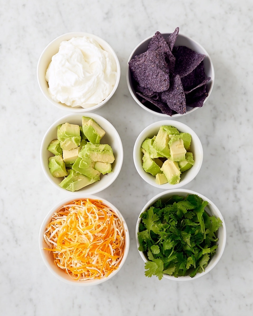 The image shows six white bowls arranged on a white marbled surface. At the top left, a bowl holds white sour cream with a soft texture. Next to it, the middle top bowl has dark purple tortilla chips broken into pieces. The top right bowl contains light green avocado chunks with a smooth texture. On the bottom left, there is a bowl filled with shredded orange and white cheese mixed together. The bottom right bowl holds fresh green cilantro leaves with a leafy texture. The bowls form a loose circle, each ingredient clear and distinct, photo taken with an iphone --ar 4:5 --v 7