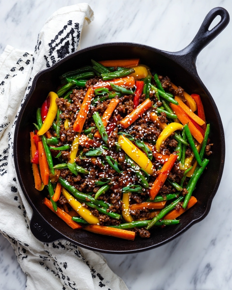 A black cast iron pan filled with a colorful stir-fry showing three main layers: the bottom layer is a mix of green beans and sliced yellow bell peppers, the middle layer has bright orange carrot sticks spread evenly, and the top layer is made of small pieces of cooked ground meat coated in a dark sauce sprinkled with white sesame seeds. The pan sits on a white marbled surface next to a white cloth with black patterns. photo taken with an iphone --ar 4:5 --v 7