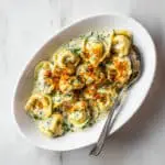 Creamy Pesto Tortellini Bake with Mozzarella Recipe