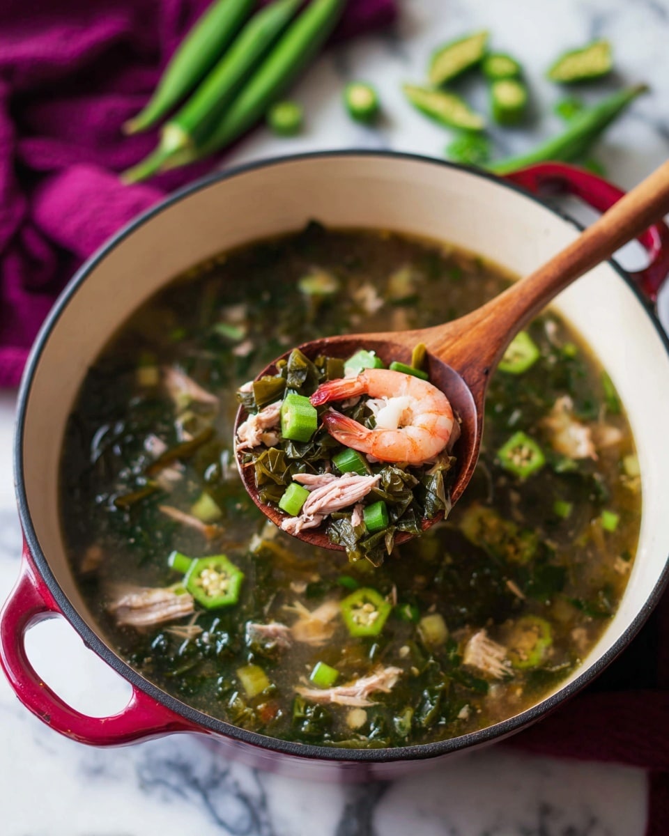 A white pot filled with soup that has dark green leafy vegetables and small green okra pieces floating in a clear broth. In the center, a wooden spoon lifts a portion showing two small pink shrimp, a piece of light brown shredded meat, and green okra slices. The pot rests on a white marbled surface with a purple cloth and green okra pods in the blurred background. The pot has a red handle and black rim. Photo taken with an iphone --ar 4:5 --v 7