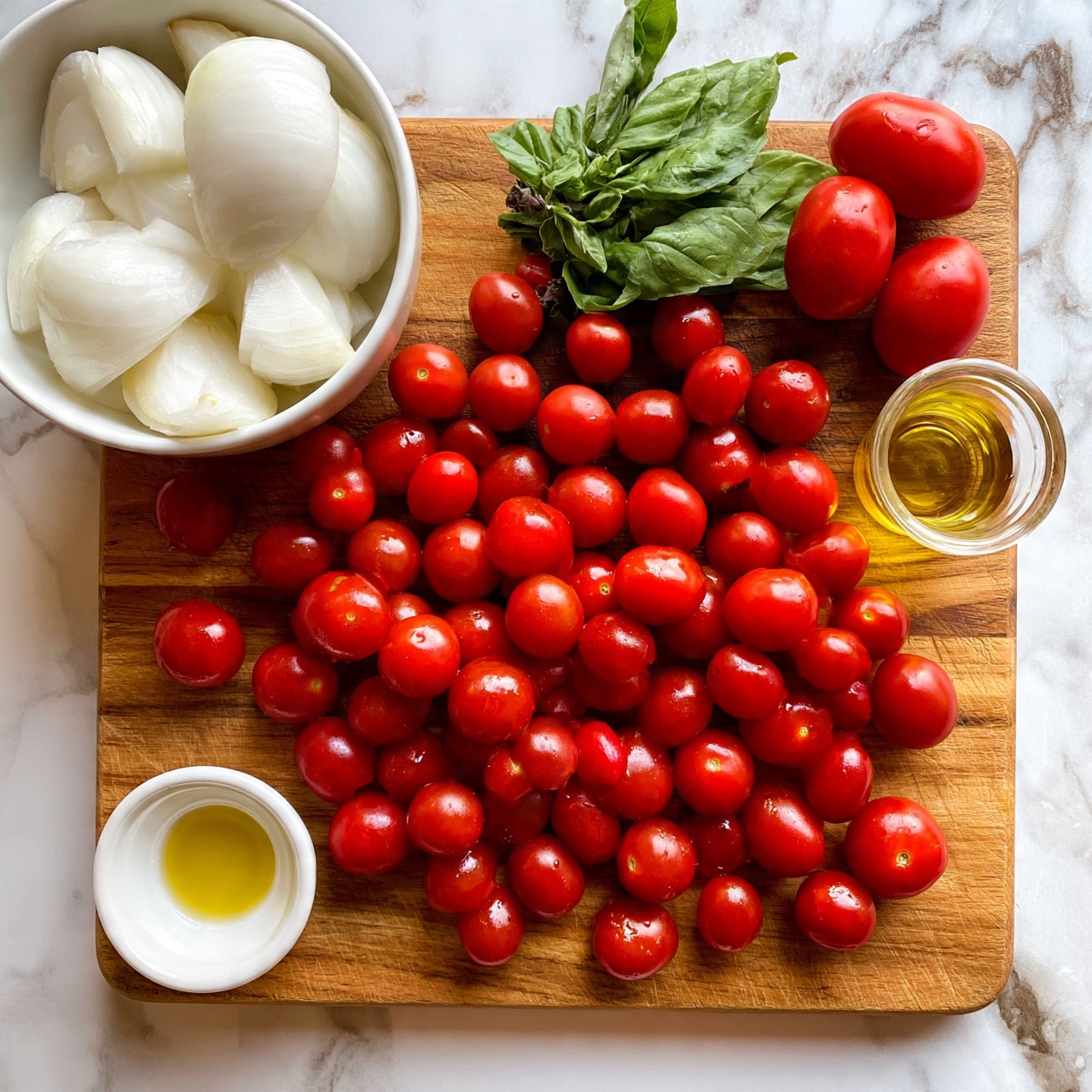 square image The image shows a wooden cutting board placed on a white marbled surface, filled with many small, round, bright red cherry tomatoes scattered all over it. To the top left, there is a white bowl holding several large white onion pieces. Fresh green basil leaves and two bright red cherry tomatoes are positioned near the top right corner of the cutting board. A small clear glass cup of yellow olive oil is on the right side of the cutting board, and a small white bowl with olive oil is placed on the bottom left of the board. Photo taken with an iphone --ar 4:5 --v 7