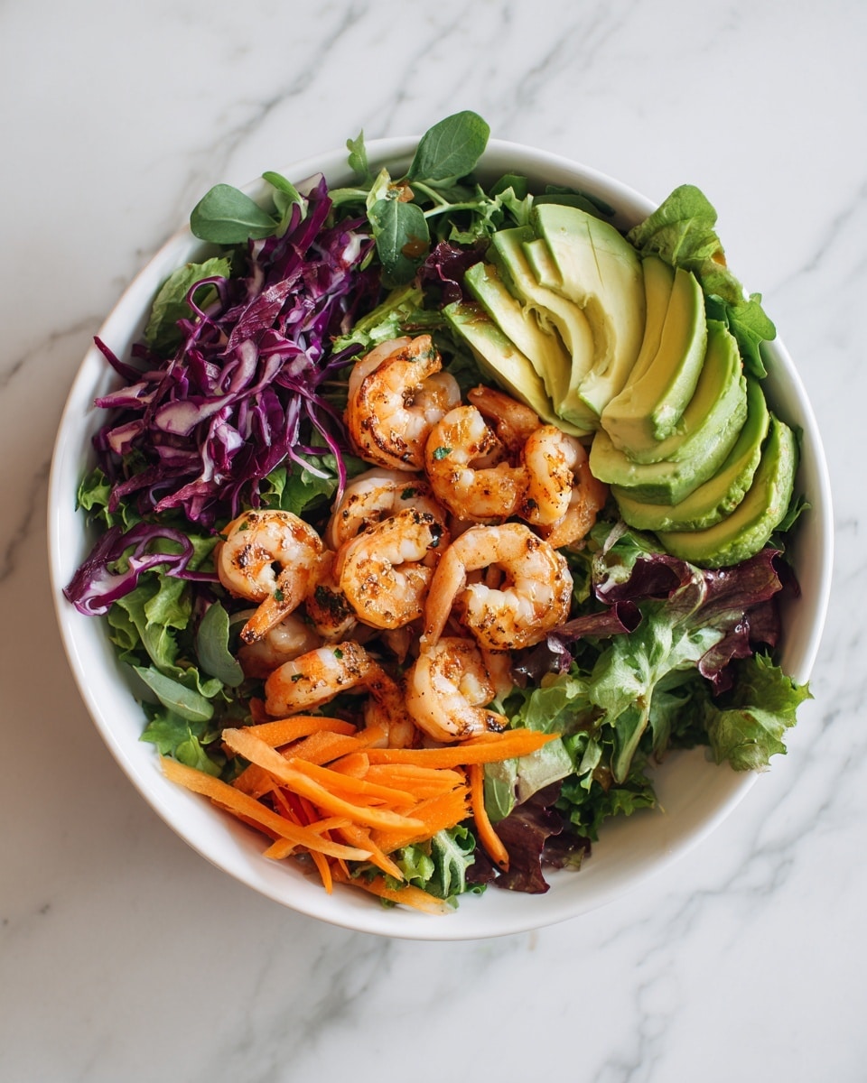 A white bowl filled with a fresh salad on a white marbled surface. The salad has a base layer of mixed green leafy vegetables, including some purple leaves. On top, there are cooked shrimp with a light brown grilled texture, scattered evenly across the salad. There are also sliced avocado pieces with a smooth green color and sliced orange carrots adding bright color throughout. The shrimp and vegetables create a colorful and fresh look, with a mix of textures from soft to crunchy. Photo taken with an iphone --ar 4:5 --v 7