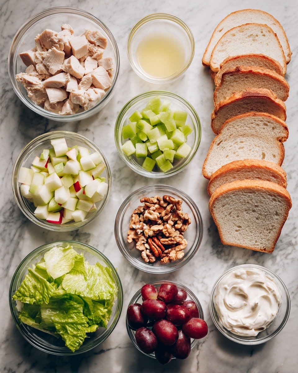 The image shows several clear glass bowls arranged on a white marbled surface, each filled with different ingredients. Starting from the top left, there is a bowl filled with chunks of light-colored cooked chicken, next to a small bowl of pale yellow lemon juice. To the right is a bowl of small green celery pieces and a bowl of chopped brown nuts. Below these, a few bright green leafy lettuce pieces lie on the surface. Next to the lettuce, a bowl holds small chopped pieces of red apple with white inside. Beside it, there is a bowl of creamy white mayonnaise. Below, a bowl filled with red grapes is placed next to a tiny clear bowl containing salt and pepper. On the right side of all the bowls, there are four slices of light golden brown bread stacked slightly overlapping each other. The photo taken with an iphone --ar 4:5 --v 7