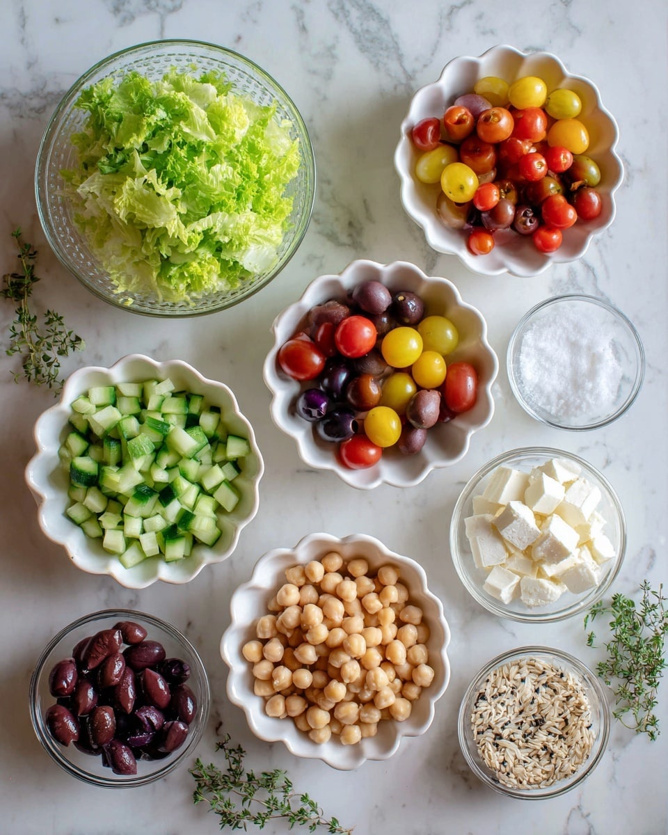 The image shows several bowls and plates arranged on a white marbled surface. There is a glass bowl with bright green chopped lettuce at the top left. Next to it is a white scalloped bowl with colorful halved cherry tomatoes in red, yellow, and dark purple shades. Below the lettuce is a white scalloped bowl filled with chopped green cucumbers. Near the bottom center is another white scalloped bowl filled with round beige chickpeas. To the left bottom corner, a white scalloped bowl contains dark brown and purple olives. On the right side, a small white bowl has white cubes of cheese, and next to it is a tiny white bowl with coarse salt inside. At the bottom right, two glass bowls hold uncooked grains—one with light brown rice and the other with black and white quinoa seeds. Small green herb sprigs lie near the olives. The photo taken with an iphone --ar 4:5 --v 7