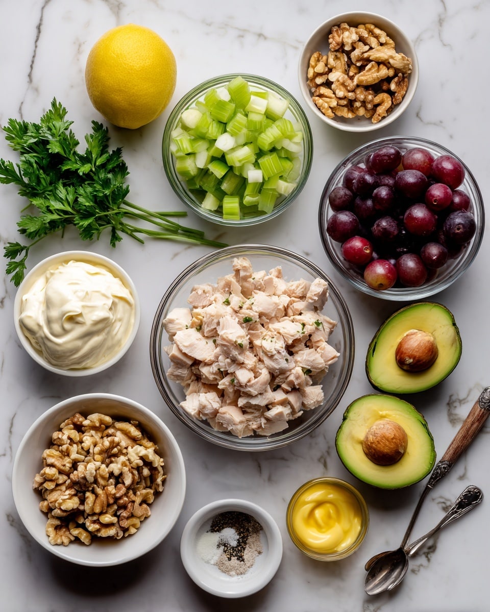 The image shows several small white bowls and one clear glass bowl arranged on a white marbled surface. The clear glass bowl in the center is filled with chopped cooked chicken, light beige in color. Surrounding it are bowls containing finely diced light green celery, halved dark red grapes, chopped dark purple-red onion, whole walnuts, and fresh green parsley leaves. Two avocado halves with bright green flesh and a large brown seed are placed near the center. A halved lemon with bright yellow skin and juicy interior is also present, along with a small spoon holding a dollop of light yellow mustard. Additional bowls contain creamy white mayonnaise, sour cream that is white and smooth, and small amounts of salt and black pepper. photo taken with an iphone --ar 4:5 --v 7
