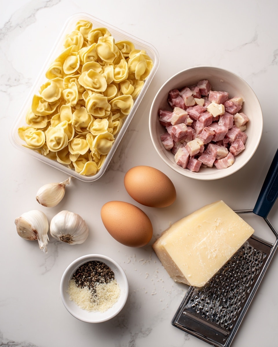 The image shows raw yellow tortellini pasta neatly packed in a clear plastic box on the left side. To the upper right, there is a white bowl filled with diced pieces of pink and white meat. Below it, three brown eggs rest on the white marbled surface. Near the bottom left, three garlic cloves are placed beside a small white bowl holding coarse black pepper. In the bottom right corner, there is a block of pale yellow cheese next to a metal grater with some cheese grated on it. All items are arranged on a white marbled surface. Photo taken with an iphone --ar 4:5 --v 7