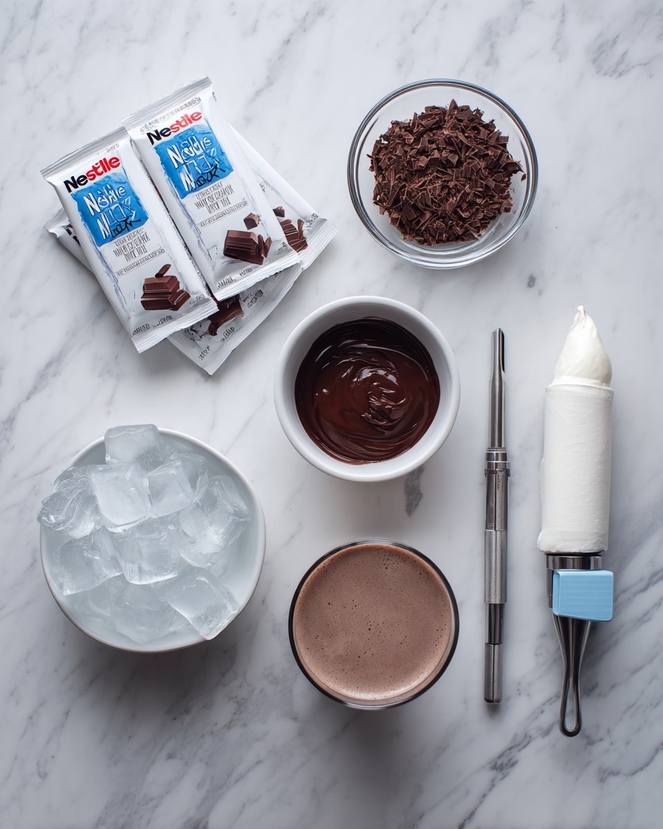 The image shows several ingredients and tools arranged neatly on a white marbled surface. On the left side, there are three Nestlé hot cocoa mix packets stacked together. To the right of these packets, there is a small white bowl filled with chocolate shavings. Above this bowl is another small white bowl with dark, shiny melted chocolate inside. Next to it, a round white bowl filled with clear ice cubes is placed. Beside the ice bowl, there is a clear glass filled with frothy chocolate milk. At the bottom right, a piping bag with white cream is visible, sealed with a blue clip and fitted with a metal decorating tip. The photo taken with an iphone --ar 4:5 --v 7