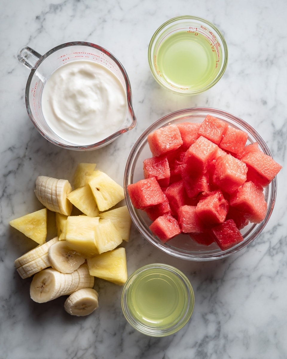 The image shows a white marble surface with two clear measuring cups at the back; the left one is empty and the right one is filled with bright red watermelon cubes. In front are two small glass bowls, one with white creamy yogurt and the other with clear light green lime juice. At the front left are chunks of yellow pineapple, and on the right are sliced pieces of a pale yellow banana. Photo taken with an iphone --ar 4:5 --v 7