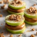 Apple “Sandwiches” with Nut Butter, Granola, and Raisins Recipe