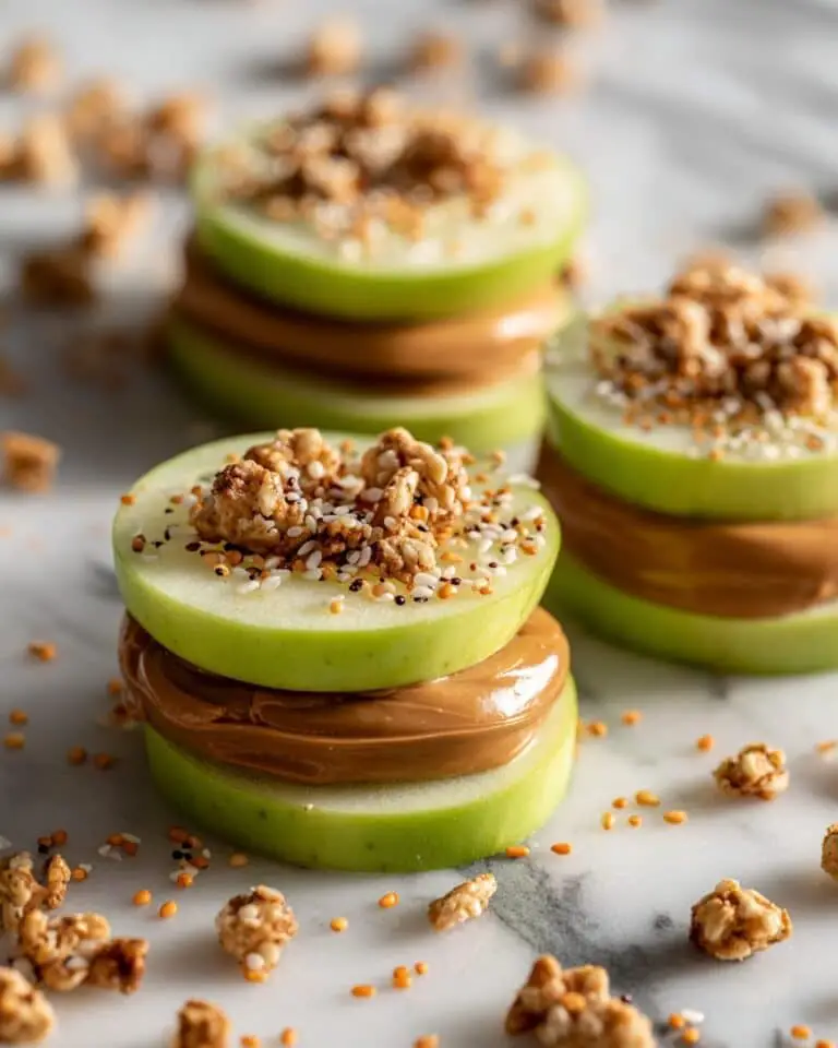 Apple “Sandwiches” with Nut Butter, Granola, and Raisins Recipe