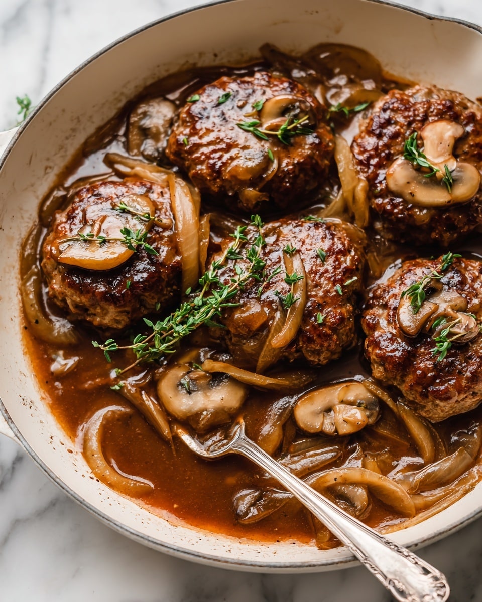 The image shows a white pan filled with four thick, browned meat patties layered with sautéed light brown onions and sliced brown mushrooms. The patties are covered in a glossy, rich brown sauce that surrounds them, and small green sprigs of fresh herbs, possibly thyme, rest on top of some patties. The sauce has a slightly thick texture with some oil shine, pooling gently around the meat and vegetables. A metal fork with a simple design is partially dipped into the sauce in the lower part of the pan. The entire scene is set on a white marbled surface. photo taken with an iphone --ar 4:5 --v 7