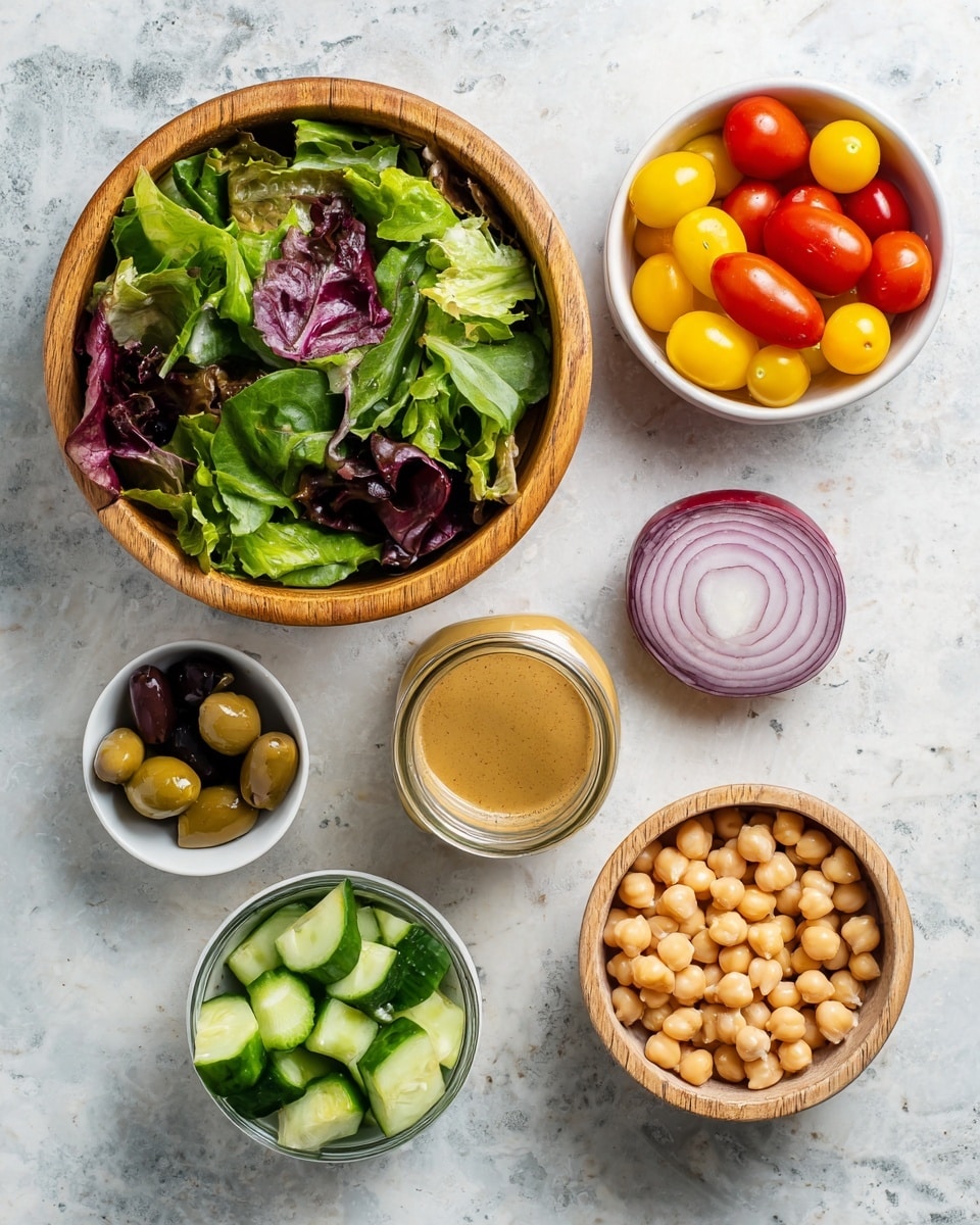 A top-down view shows six separate containers of fresh salad ingredients arranged on a white marbled surface. The largest bowl is wooden and filled with mixed green and purple leafy vegetables. To its right, a white bowl contains yellow and red small tomatoes. Below the tomato bowl, there is a small glass jar filled with light brown salad dressing. Below the dressing jar is a bowl filled with cut pieces of green cucumber. To the left of this bowl, a small white bowl holds a few dark olives. Above the olives, on the marbled surface, there is a half red onion with a smooth white inner layer. In the center, a small wooden bowl contains light tan chickpeas. Everything is set on a textured wooden surface. photo taken with an iphone --ar 4:5 --v 7
