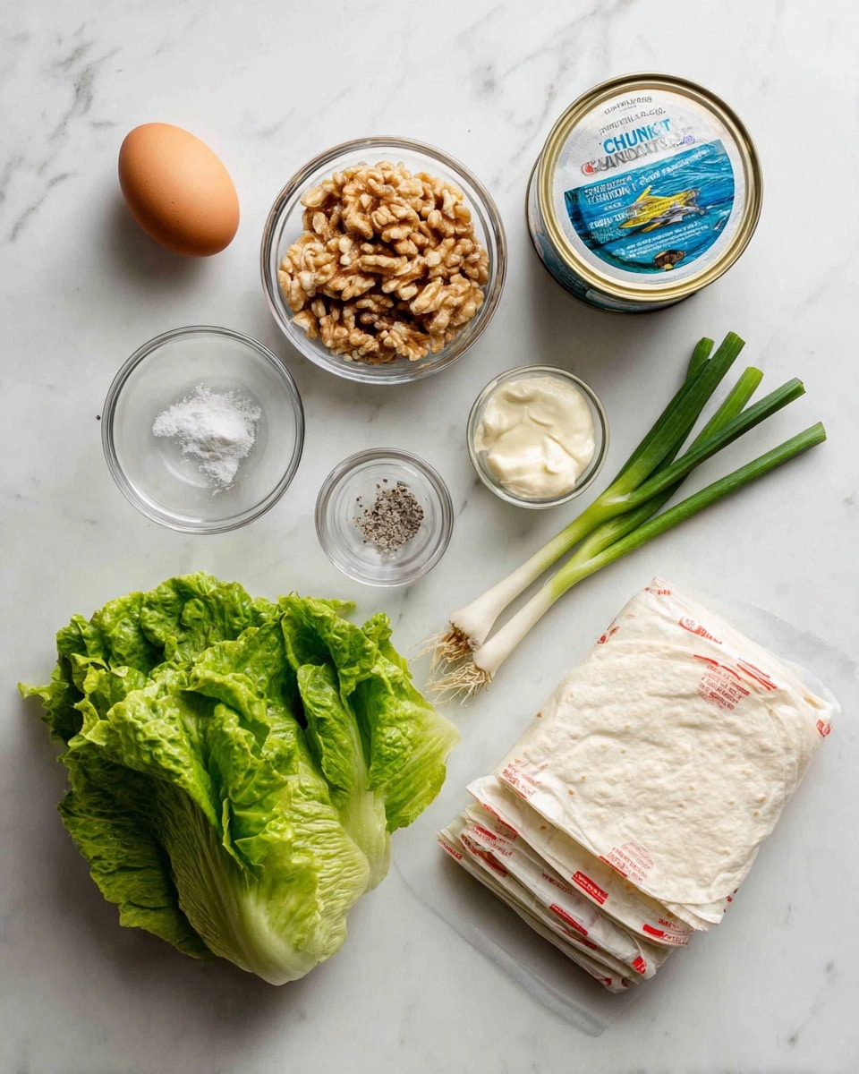 The image shows a flat lay of various fresh ingredients on a white marbled surface. From the top left, there is one brown egg followed by a small clear bowl filled with chopped walnuts. To the right is a can of chunk light tuna in water with a blue and white label. Below the egg, there is a small clear bowl containing salt and pepper, next to a small measuring cup with a white liquid, and a tablespoon of mayonnaise. In the center, there is a small bunch of fresh, green romaine lettuce leaves with some texture visible. To the bottom right of the lettuce, there are two whole green onions laid horizontally. On the right side of the image, there is a stack of white flour tortillas in a clear plastic package with red, green, and yellow print. All items are neatly spaced out on the white marbled surface. photo taken with an iphone --ar 4:5 --v 7